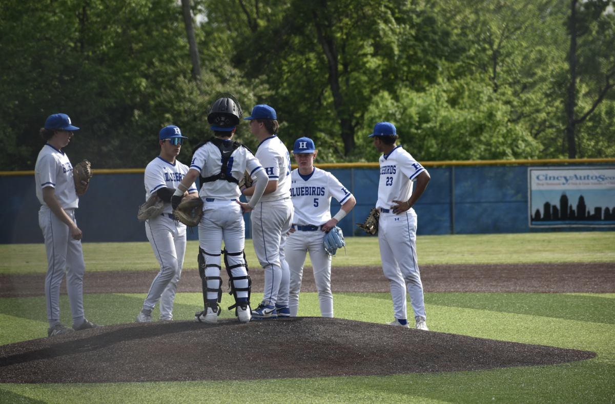 The Highlands varsity outfield gathers at the mound during a timeout to discuss their game plan. 